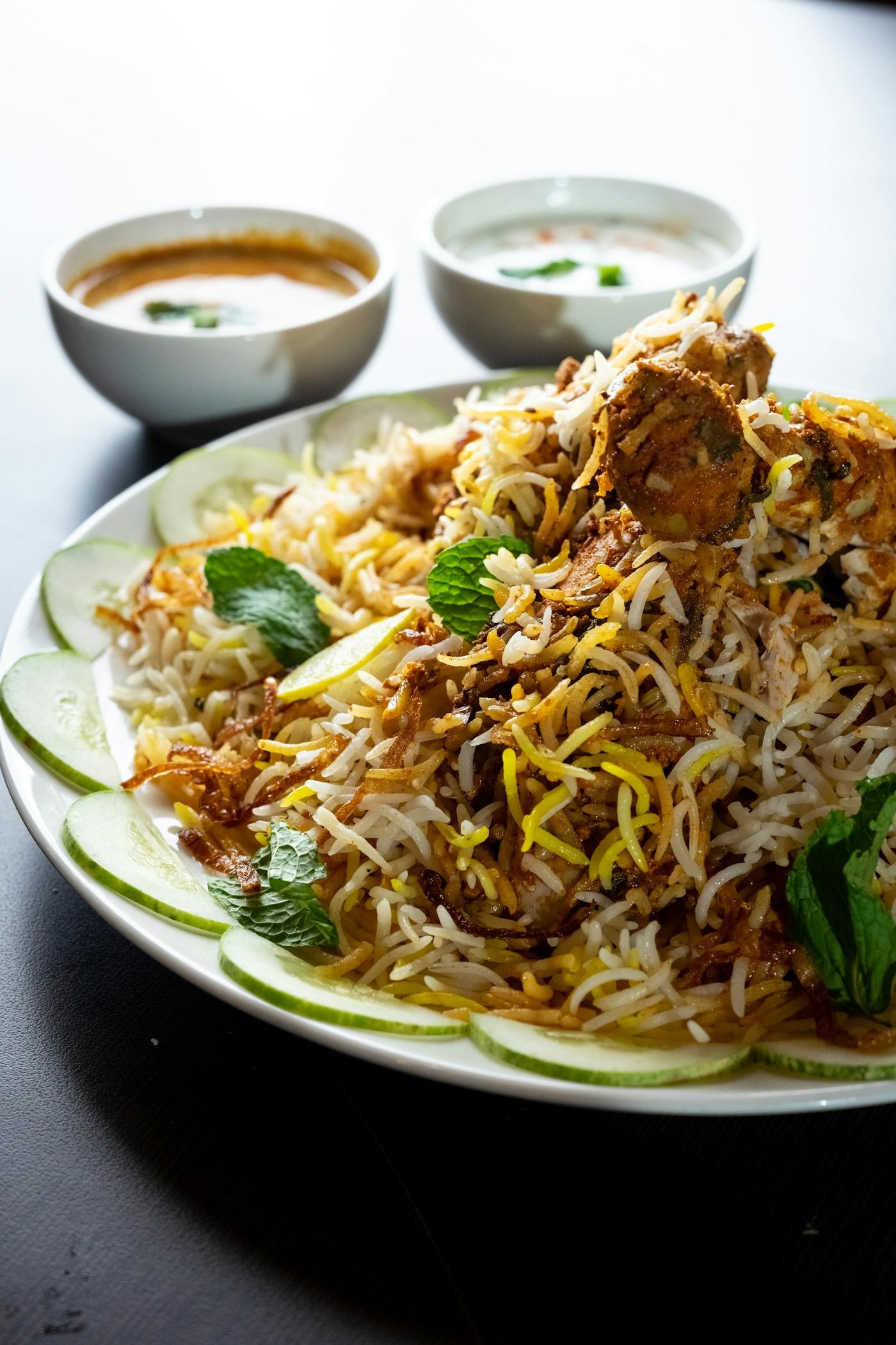 Layered Hyderabadi biryani in a handi for Nani's Shahi Hyderabadi Biryani recipe card